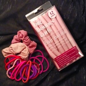 Hair ties and Hair twist curlers in a variety of Pinks